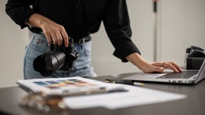 cropped-shot-female-photographer-checking-images-laptop-computer-studio (1)